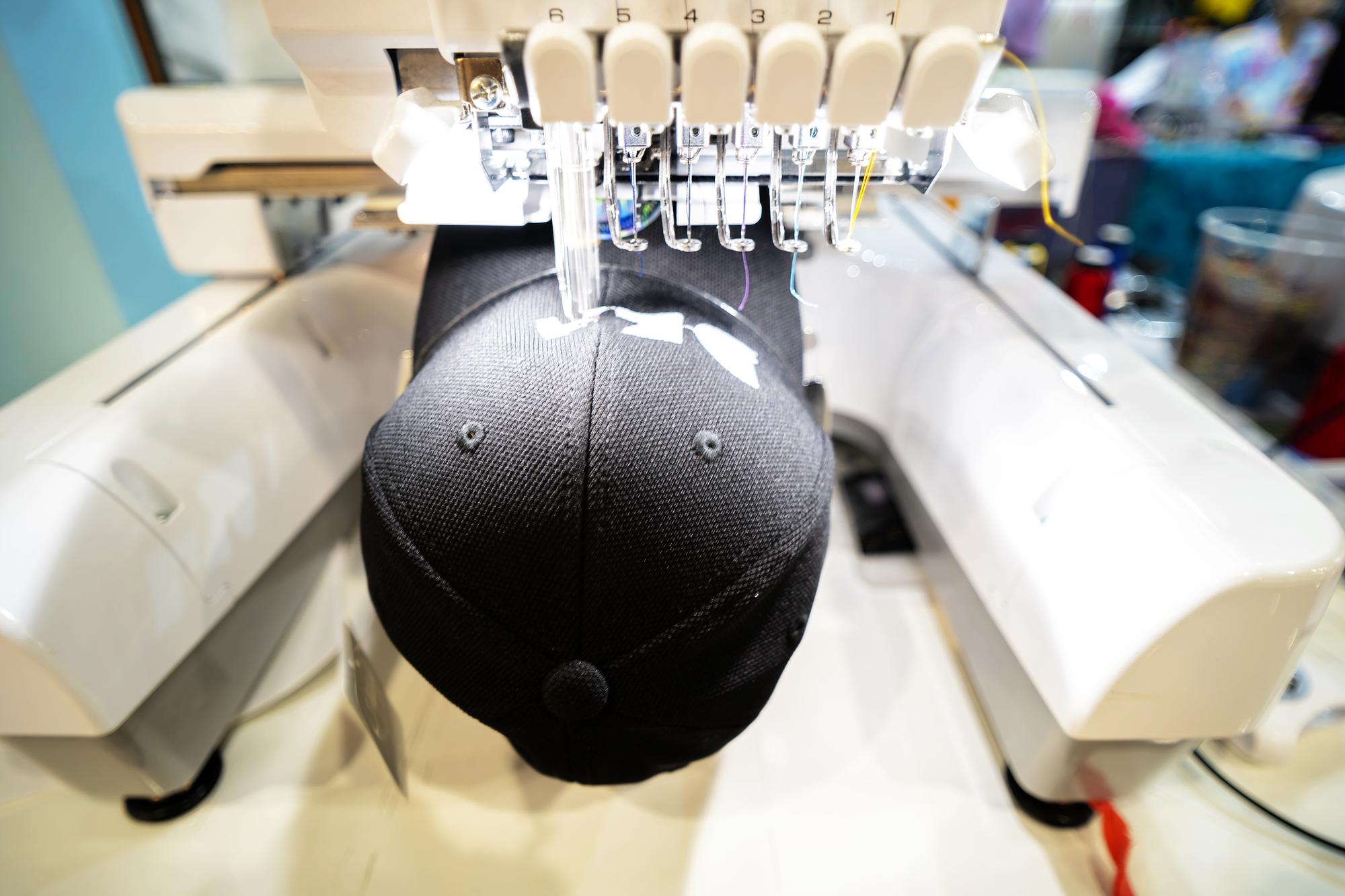industrial embroidery machine stitching a brand patch